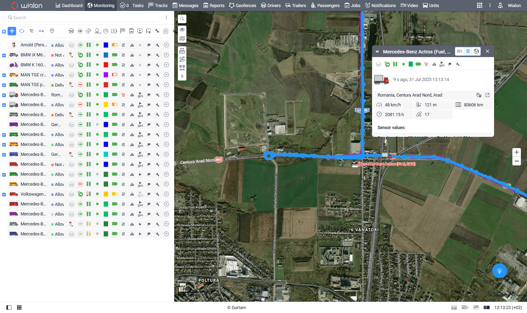 Wialon live map showing a vehicle track, unit list and sensor details